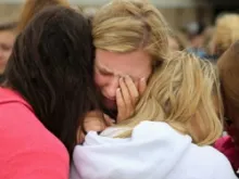 Locals console each other after a fertilizer plant explosion n West, Texas. 