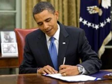 President Barack Obama signs a bill into law