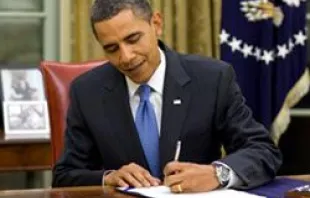 President Barack Obama signs a bill into law 