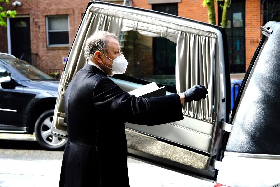 Monsignor Kieran Harrington blesses the coffin of Fr. Jorge Ortiz-Garay before its trip to Mexico. ?w=200&h=150
