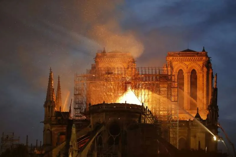 Firefighters douse flames billowing from the roof at Notre-Dame Cathedral in Paris, April 15, 2019. ?w=200&h=150