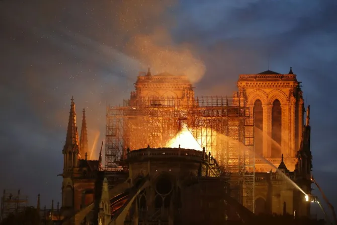Firefighters douse flames billowing from the roof at Notre Dame Cathedral in Paris April 15 2019 Credit Francois Guillot AFP Getty Images