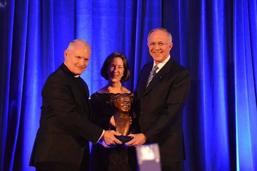 Fr. Arne Panula presents Carl and Dorian Anderson with the St. John Paul II Award for the New Evangelization in Washington, D.C., Oct. 29, 2014. ?w=200&h=150