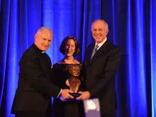 Fr. Arne Panula presents Carl and Dorian Anderson with the St. John Paul II Award for the New Evangelization in Washington, D.C., Oct. 29, 2014. 