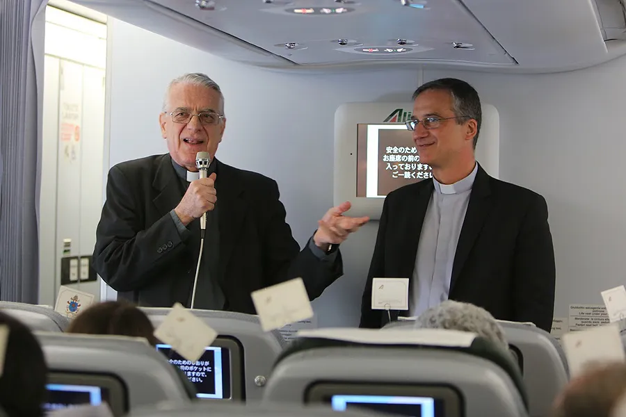 Fr. Federico Lombardi, Holy See press officer, and Msgr. Dario Vigano, prefect of the communications secretariat, aboard the papal flight to Quito, July 5, 2015. ?w=200&h=150