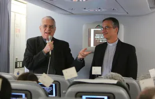 Fr. Federico Lombardi, Holy See press officer, and Msgr. Dario Vigano, prefect of the communications secretariat, aboard the papal flight to Quito, July 5, 2015.   Alan Holdren/CNA.