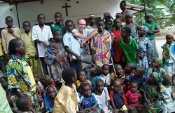 Fr. Georges Vandenbeusch, who was kidnapped by Boko Haram in Cameroon Nov. 14, surrounded by his parishioners in 2012. ?w=200&h=150