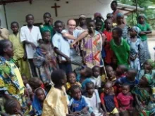 Fr. Georges Vandenbeusch, who was kidnapped by Boko Haram in Cameroon Nov. 14, surrounded by his parishioners in 2012. 
