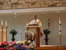 Fr. Gregory Bierbaum speaks at Mass May 9. 