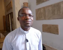 Fr. Isaac Vondoame stands inside the Vatican Museums during an interview with CNA.?w=200&h=150