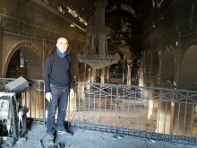 Fr. Georges Jahola in Al-Tahira church in Bakhdida in November 2016, shortly after the town's liberation. Photo courtesy of Fr. Jahola.
