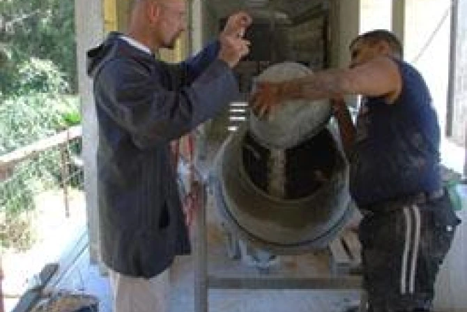 Fr Jeremias talks to a worker on the building site CNA World Catholic News 5 27 11