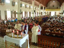 Fr. Joseph Tran Duc Ngoi recites Lenten meditations at Trai Le Parish, Central Vietnam. 