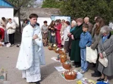 Fr. Mykola Kvych, naval chaplain in Sevastopol, blesses Easter baskets in 2013.