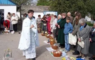 Fr. Mykola Kvych, naval chaplain in Sevastopol, blesses Easter baskets in 2013. UGCC Information Department.