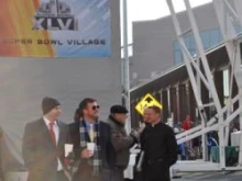 Fr. Rick Nagel of St. John the Evangelist (far right) on the street before Superbowl XLVI. 