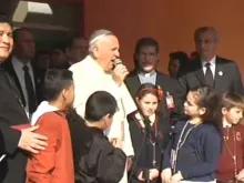 Pope Francis speaks with patients outside Asuncion's Niños de Acosta Ñu pediatric hospital, July 11, 2015. 