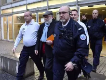 Bernard Preynat (2nd-L), a former priest who been convicted and sentenced for sexual assault, leaves the Lyon courthouse, Jan. 17, 2020. 