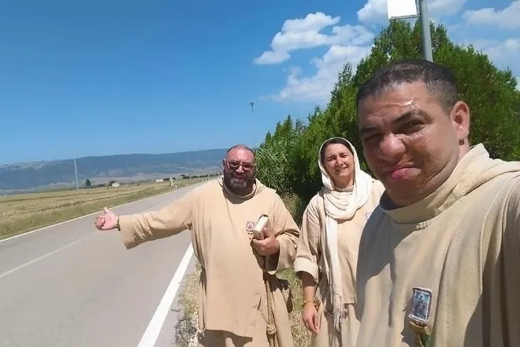 Friar Juan Maria Crisostomo (Right) hitchhiking with a fellow friar and Little Sister of Jesus and Mary. Credit: Poor Friars.
