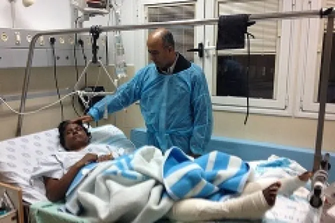 Friar Tojy Jose OFM Head of Indian Chaplaincy of Holy Land visits a burn victim in Ranbam Hospital in Haifa Credit Indian Chaplaincy of Holy Land CNA 2 20 14