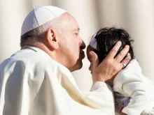 Pope Francis kisses a child at the general audience on Oct. 10, 2018. 