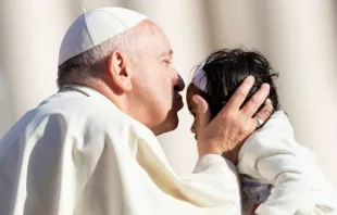 Pope Francis kisses a child at the general audience on Oct. 10, 2018.   Daniel Ibanez/CNA.