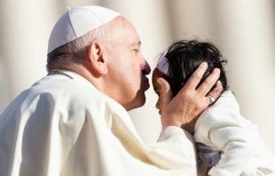 Pope Francis kisses a child at the general audience on Oct. 10.   Daniel Ibanez.