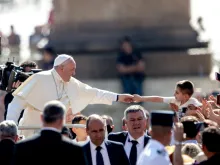 Pope Francis greets pilgrims in St. Peter's Square June 19, 2019. 