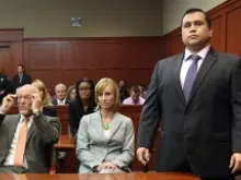 George Zimmerman (R) stands as the jury arrives to deliver the verdict at the Seminole County Criminal Justice Center. 