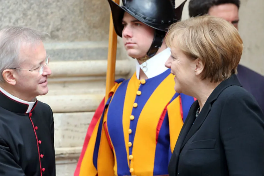 German Chancellor Angela Merkel prepares to meet Pope Francis. ?w=200&h=150