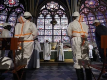 Archbishop Michel Aupetit, center left, celebrates Mass at Notre-Dame Cathedral, Paris, France, June 16, 2021.