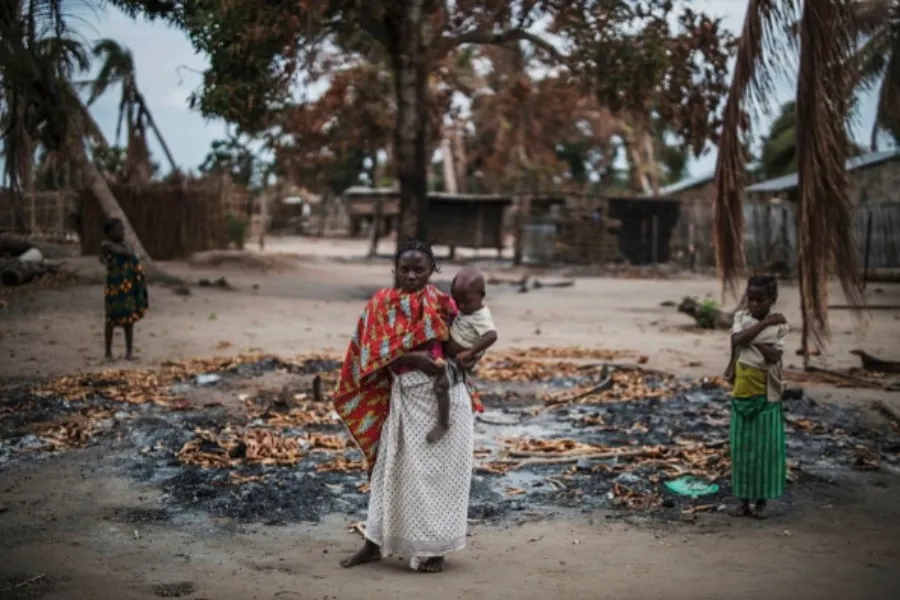 A woman stands in a burned out area after an extremist attack on the village of Aldeia da Paz, Mozambique, Aug. 24, 2019.?w=200&h=150
