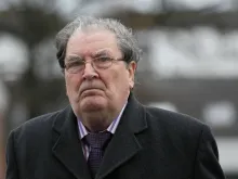 Former Northern Ireland politician and Joint 1998 Nobel Peace Prize Winner John Hume attends a funeral service for Father Alec Reid in Belfast, Nov. 27, 2013. 