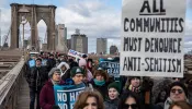 People participate in a Jewish solidarity march across the Brooklyn Bridge on Jan. 5, 2020, in New York City.