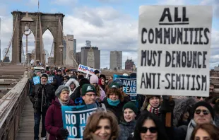 People participate in a Jewish solidarity march across the Brooklyn Bridge on Jan. 5, 2020, in New York City. Jeenah Moon/Getty Images