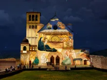Giotto’s Nativity is projected on the facade of the Basilica of St. Francis of Assisi. 
