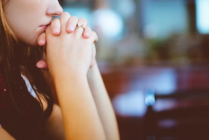 Girl praying Credit Unsplash CNA