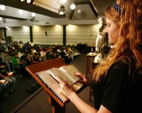 Rachel Stanley, senior at Bishop Carroll Catholic High School, leads about 150 fellow members of the God Squad in the Liturgy of the Hours. (Advance photo by Fred Solis.)?w=200&h=150