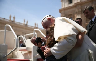 Grazia, a girl with Down syndrome, hugs Pope Francis at General Audience on May 13 2015.   Daniel Ibanez/CNA.