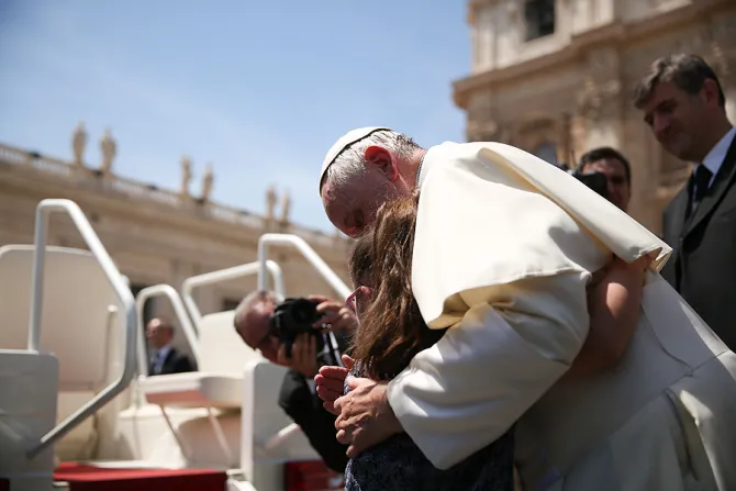 Grazia a girl with Down syndrome hugs Pope Francis at General Audience on May 13 2015 Credit Daniel Iba n ez CNA 5 13 15