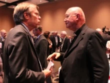 Greg Erlandson speaks with Archbishop Claudio Maria Celli. Centennial Symposium Speech. 