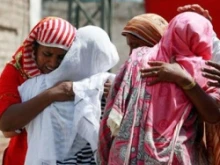 Women greive together after an outbreak of anti-Christian violence in the Punjab provence of Pakistan in August 2011. 