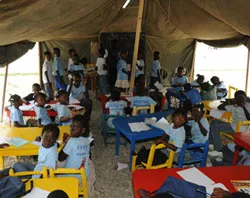 Haitian children attend school in a makeshift shelter?w=200&h=150