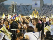 A young boy waves a Thai flag before Mass with Pope Francis in Bangkok, Thailand. 