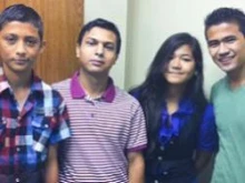 Hari Chamlagai is pictured with some of his friends and fellow refugees: Kiran Koirala, Susanna Pradhan and Yjwal Pradhan. (Chris Lux, Catholic News Herald)