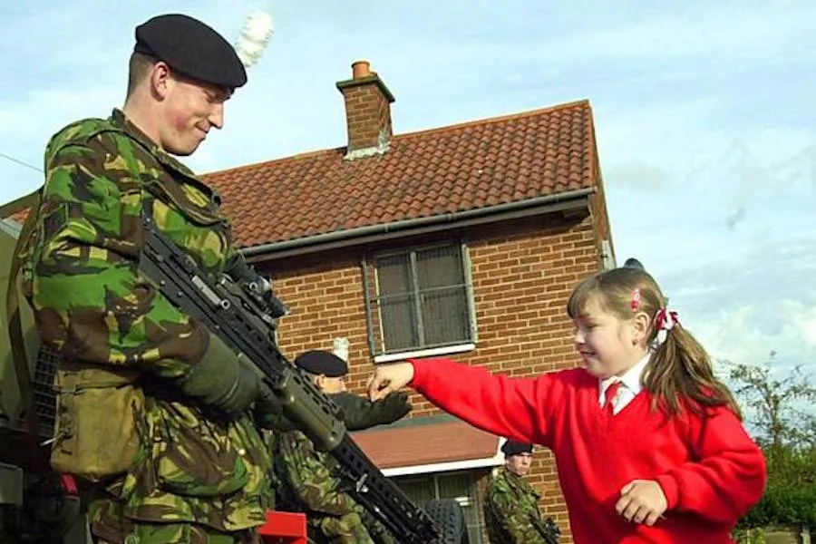 A pupil from Holy Cross Girls' School with a soldier from the Argyll and Sutherland Highlanders. ?w=200&h=150