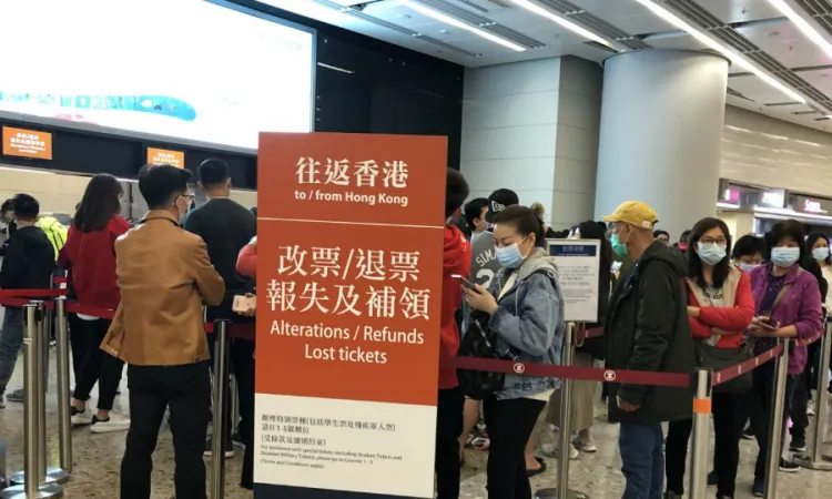 Hong Kong residents queueing to refund their bullet train tickets to the mainland in West Kowloon railway station bc coronavirus Jan 25 2020 Credit Voice of America public domain