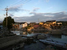 Houses sit partially submerged in floodwater in Kurashiki, Okayama, Japan, July 9, 2018. 