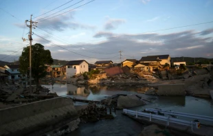Houses sit partially submerged in floodwater in Kurashiki, Okayama, Japan, July 9, 2018.   Tomohiro Ohsumi/Getty Images.