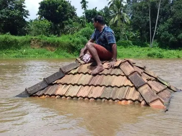 A man trapped by the flood waters in Kerala, Aug. 18, 2018. Photo courtesy of the St Vincent de Paul Society of England and Wales.?w=200&h=150